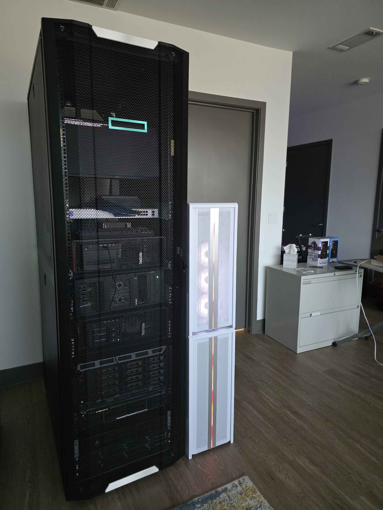 The HowToSoftware server rack standing in the room, doors closed
