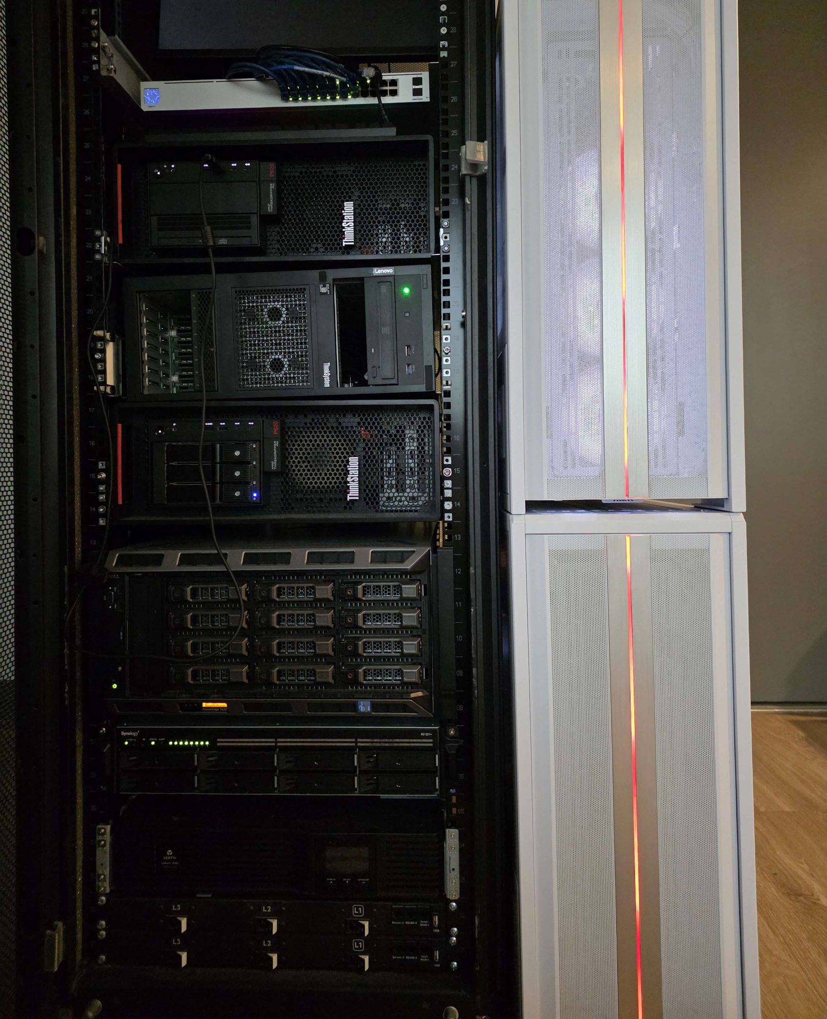 The rack with its door open, showing the machines mounted in it
